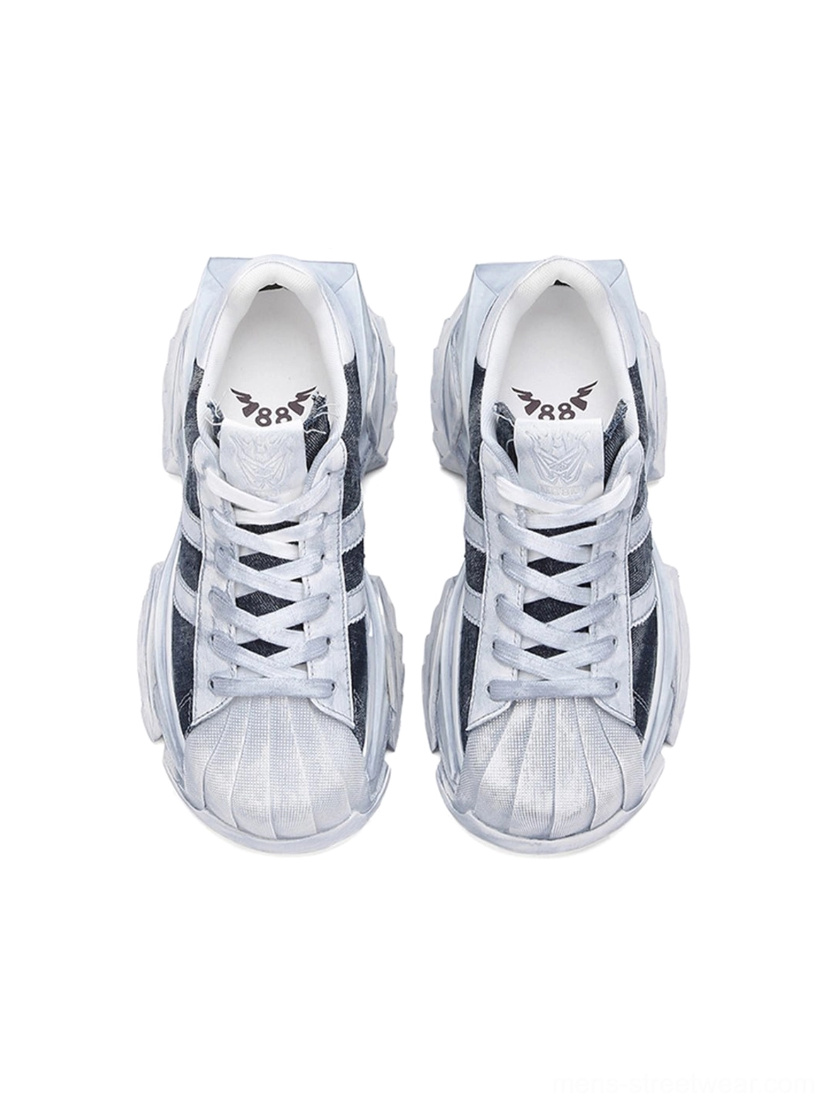 Top-down front view of washed blue platform court sneakers showing the lace-up construction, rounded shell toes, and soft interior details