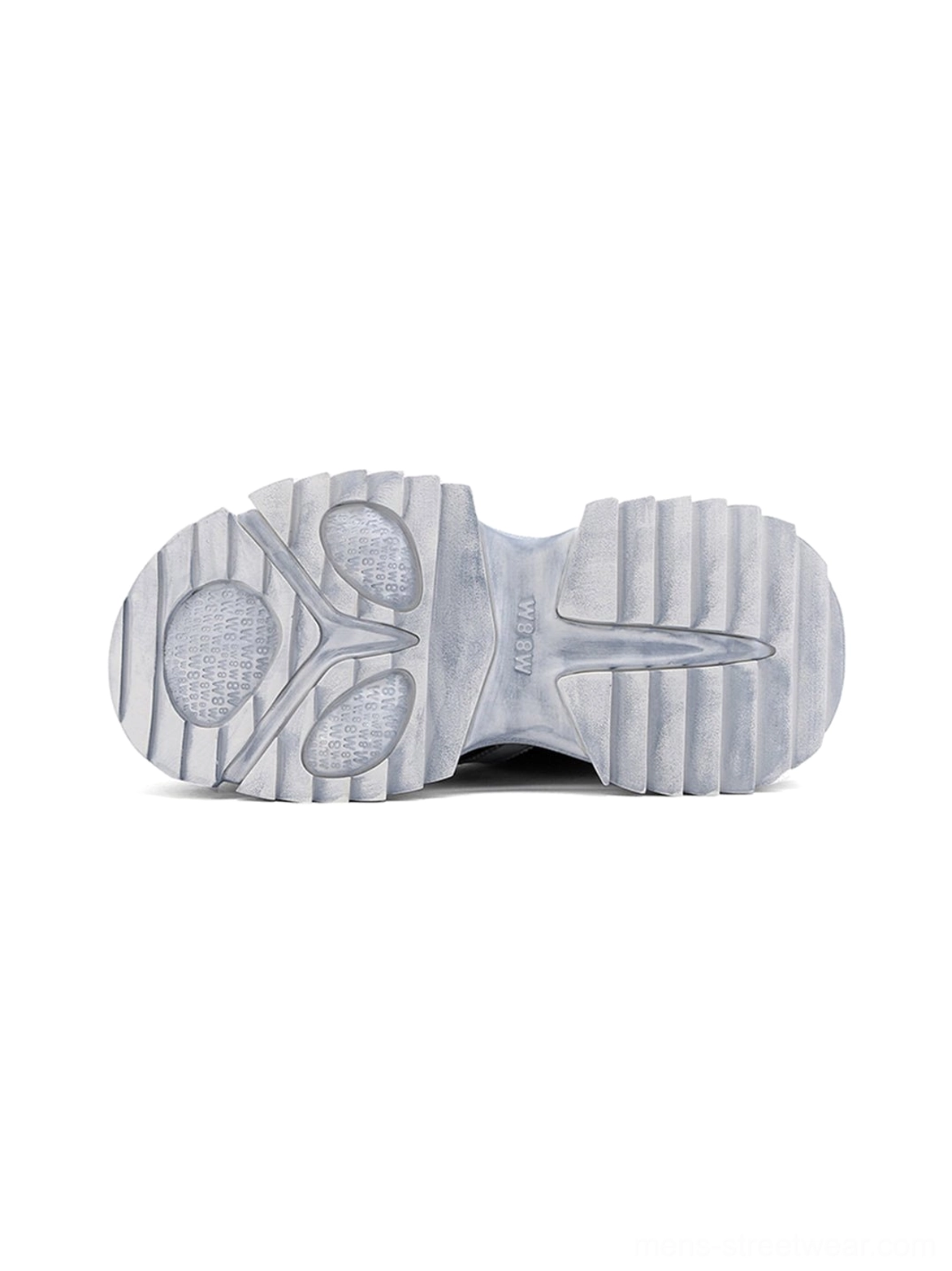 Bottom view of a washed blue platform sneaker showing the multi-directional rubber tread pattern and durable chunky outsole