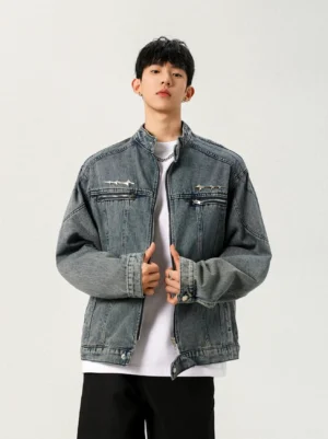 Men's washed blue stand collar denim jacket front view showing full zip closure and dual chest zipper pockets