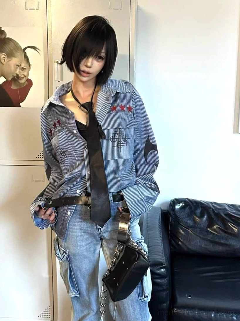 Oversized washed blue striped graphic work shirt styled with black tie cargo jeans and punk streetwear accessories