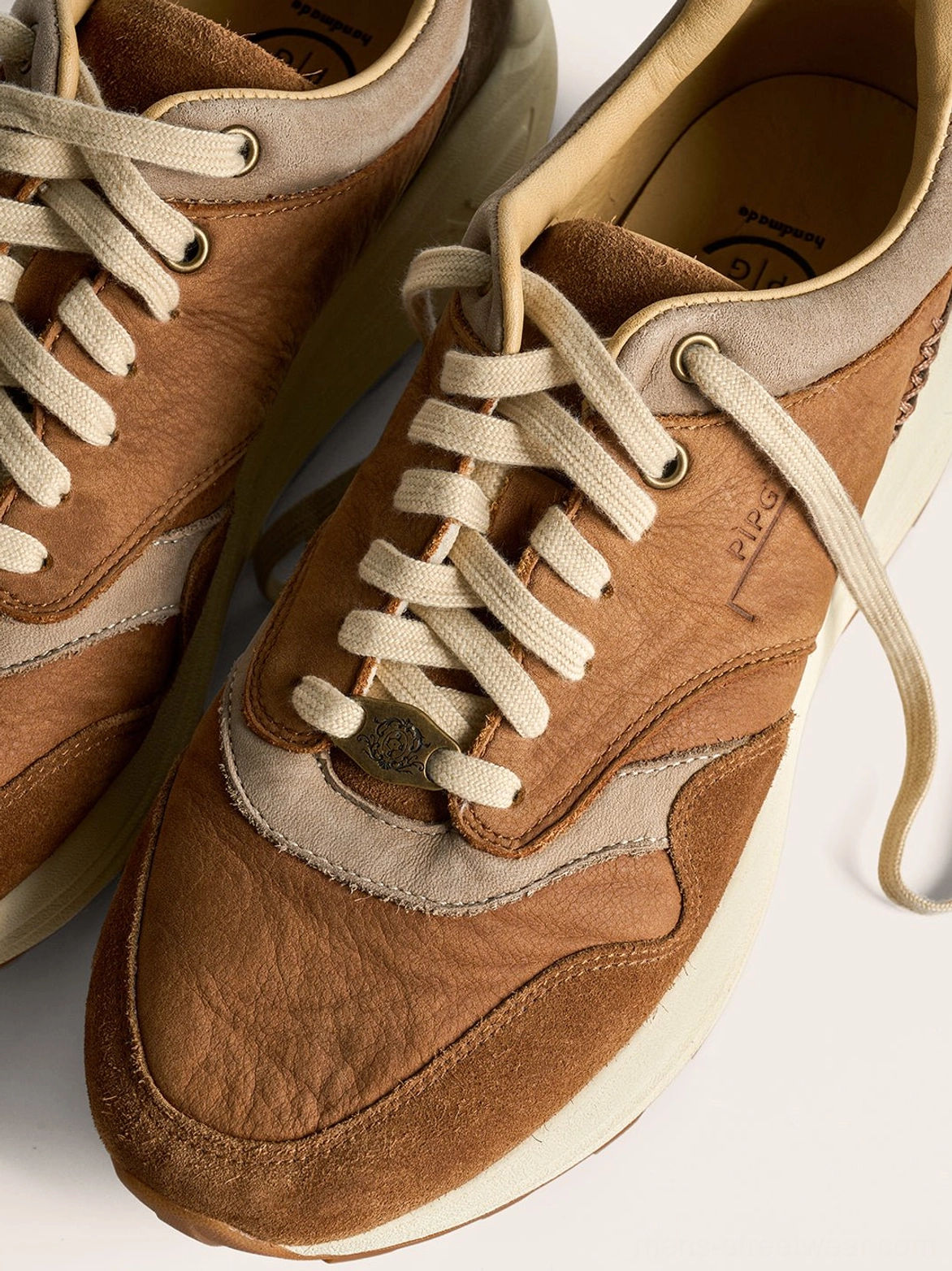 Coffee and brown retro trail runner sneakers styled as versatile unisex streetwear footwear