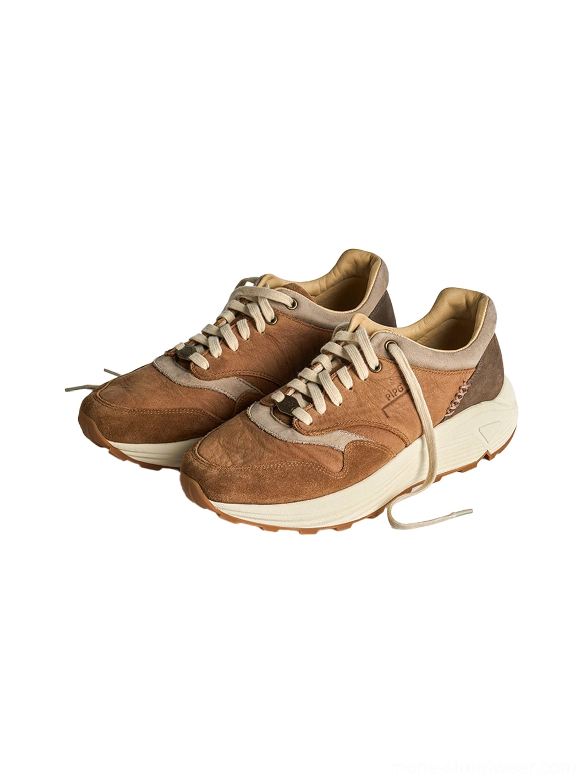 Retro brown suede sneakers with a thick off-white midsole and rugged lugged runner outsole
