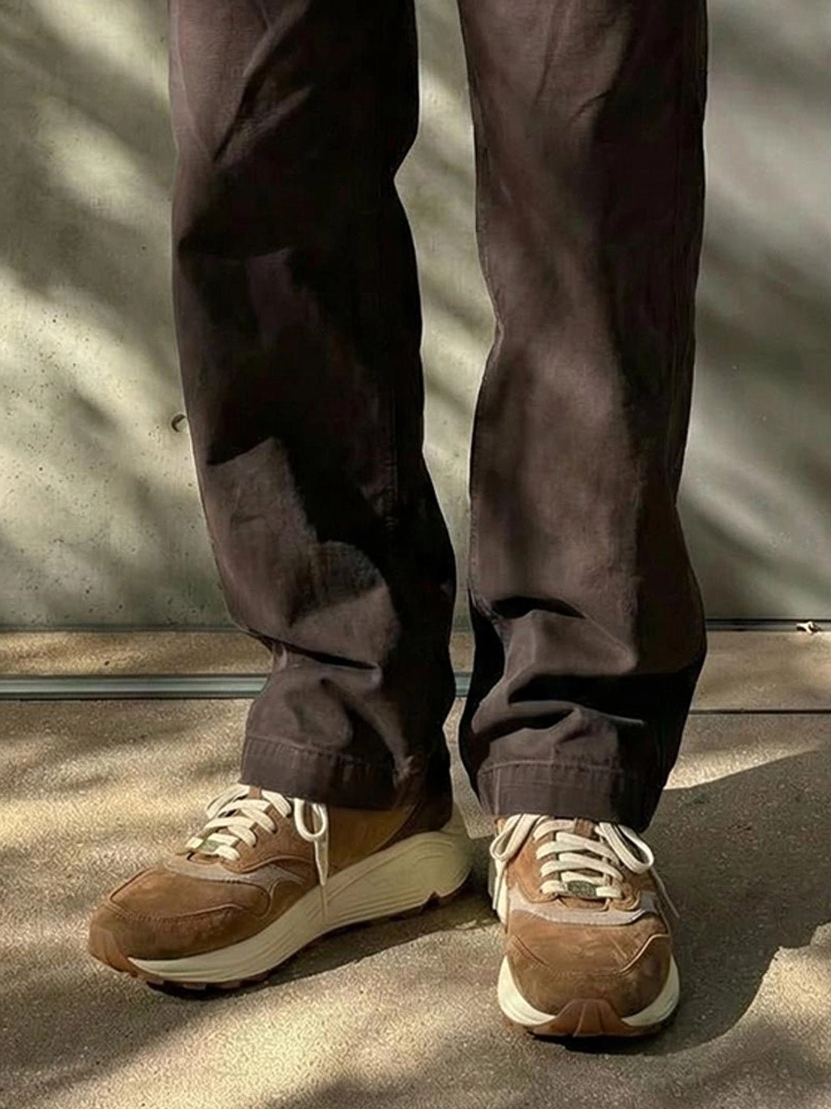 Vintage-inspired brown retro running sneakers with earthy color blocking and a durable-looking trail outsole