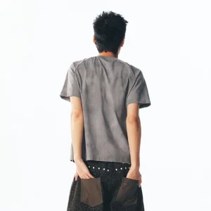 Back view of a washed cross graphic raglan T-shirt showing the solid grey back and relaxed unisex streetwear silhouette