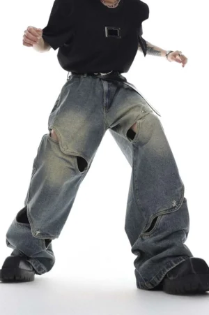 Front view of blue washed cut-out wide-leg denim jeans with metal fasteners and oversized streetwear fit