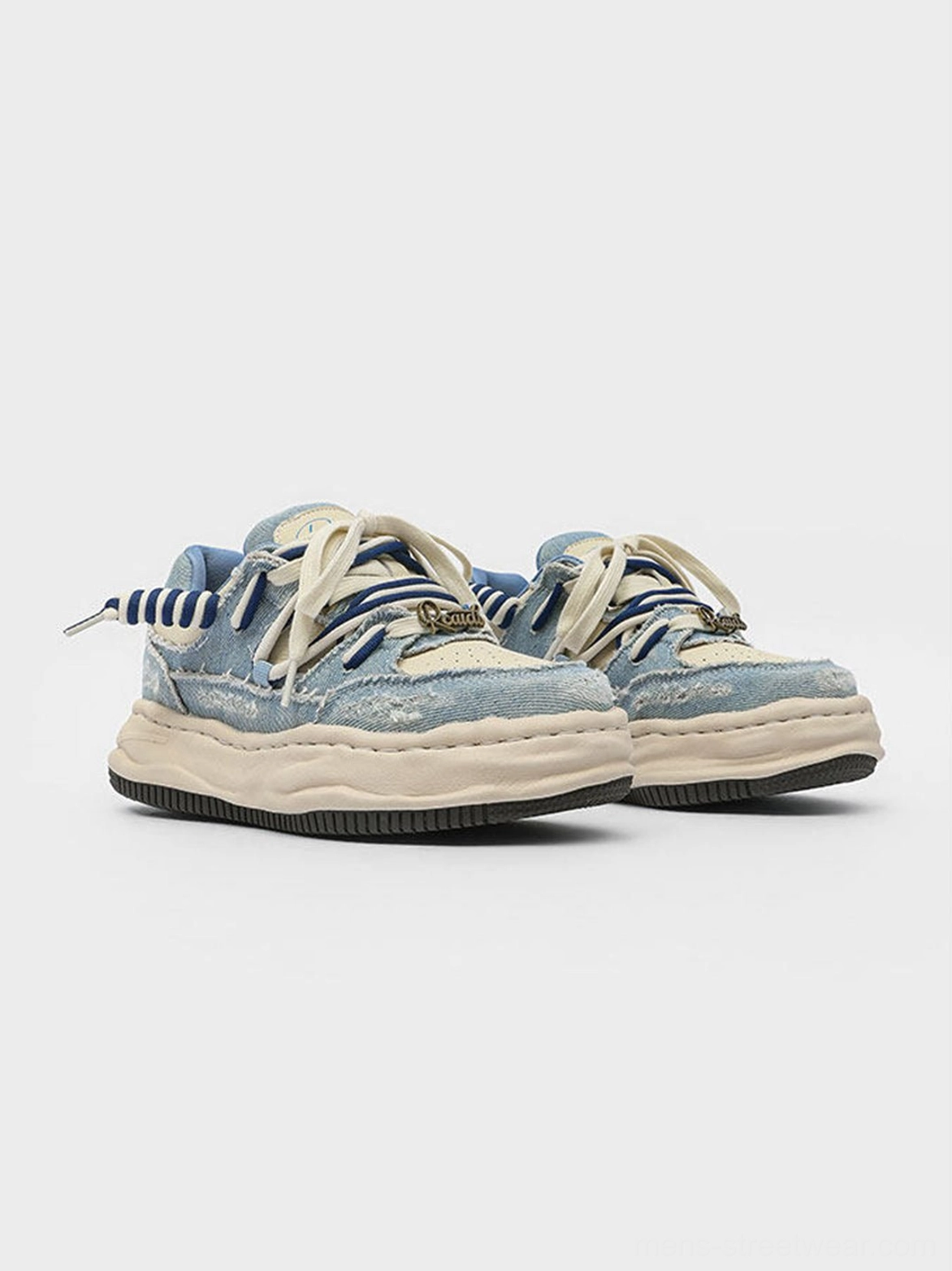 Washed denim dual-lace chunky streetwear sneakers featuring faded blue textile upper and layered lace detail