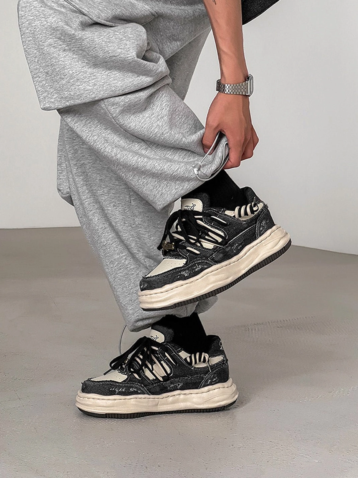 Washed denim streetwear platform sneakers designed to complement wide-leg trousers, ripped jeans, and utility clothing