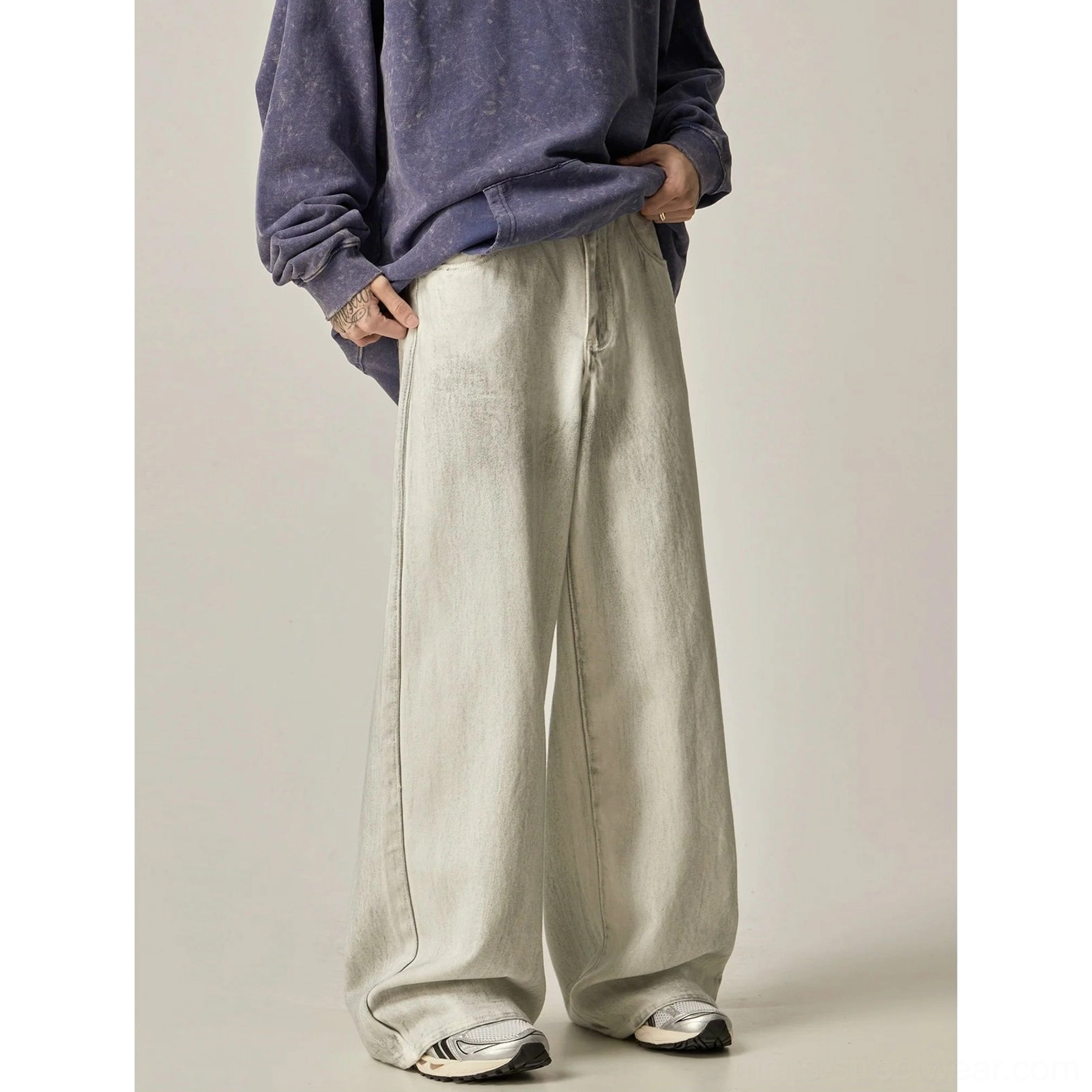 Side view of ecru wide-leg jeans styled with a purple vintage sweatshirt for Seoul-inspired streetwear outfit
