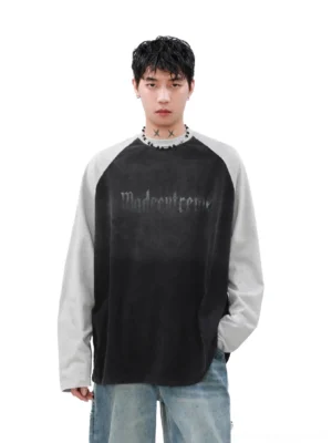 Washed gothic contrast raglan long sleeve tee worn by male model in white studio front portrait