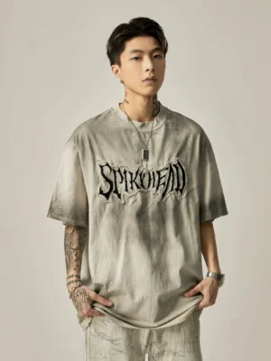 Washed gray oversized grunge streetwear T-shirt with gothic embroidered chest logo front view