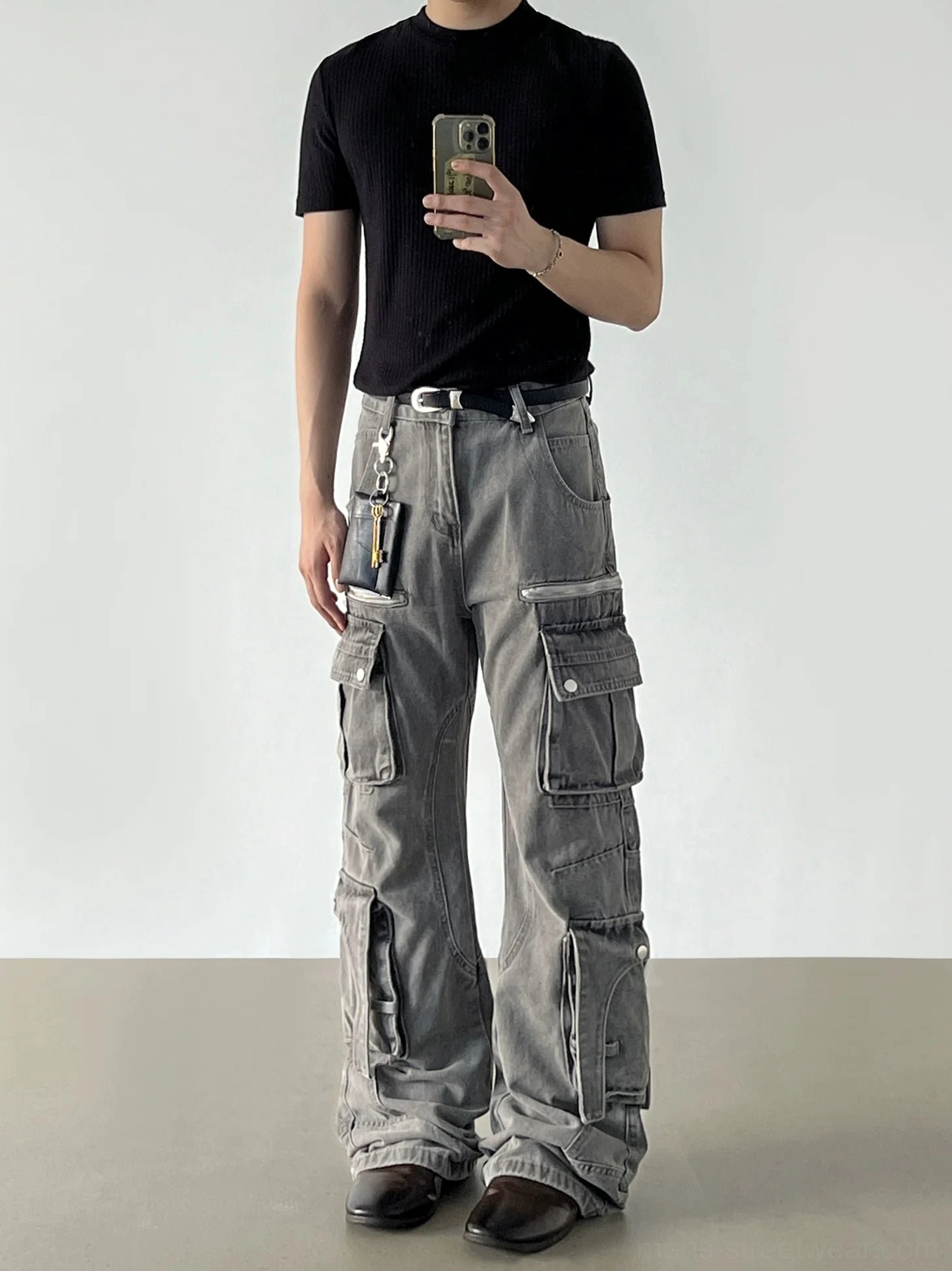 Washed grey wide-leg cargo jeans mirror outfit view showing the faded denim finish and multi-pocket utility design