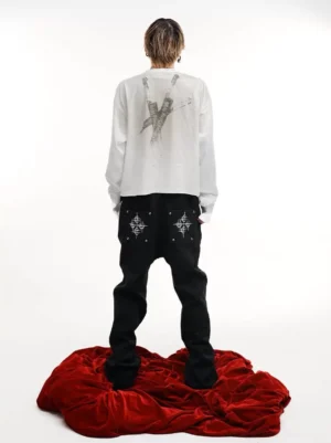Washed ivory graphic long sleeve T-shirt back view with distressed crossed blade print and relaxed fit