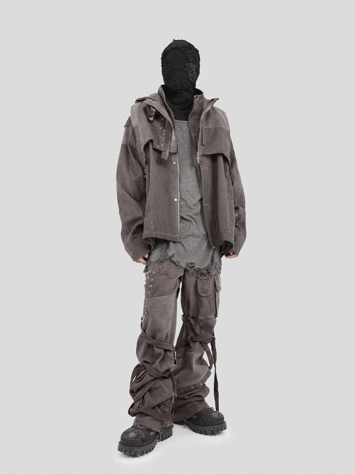 Dark grey workwear outfit styled with washed mesh tactical cargo pants matching jacket long tee and combat boots