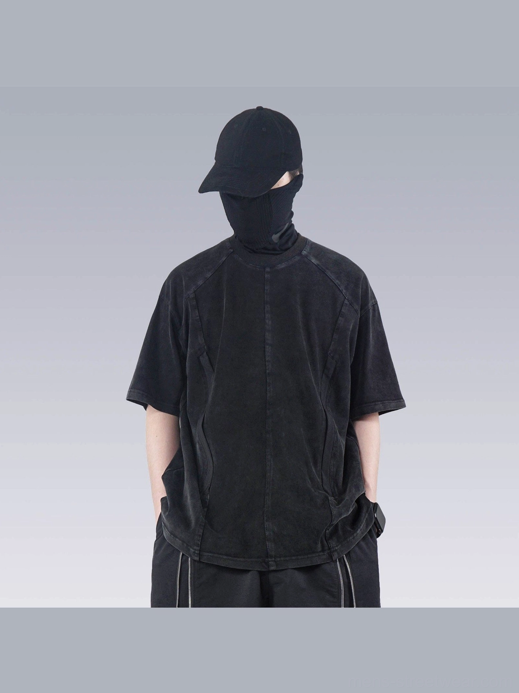 Front view of faded black washed technical oversized T-shirt with split seam construction and relaxed Korean streetwear fit