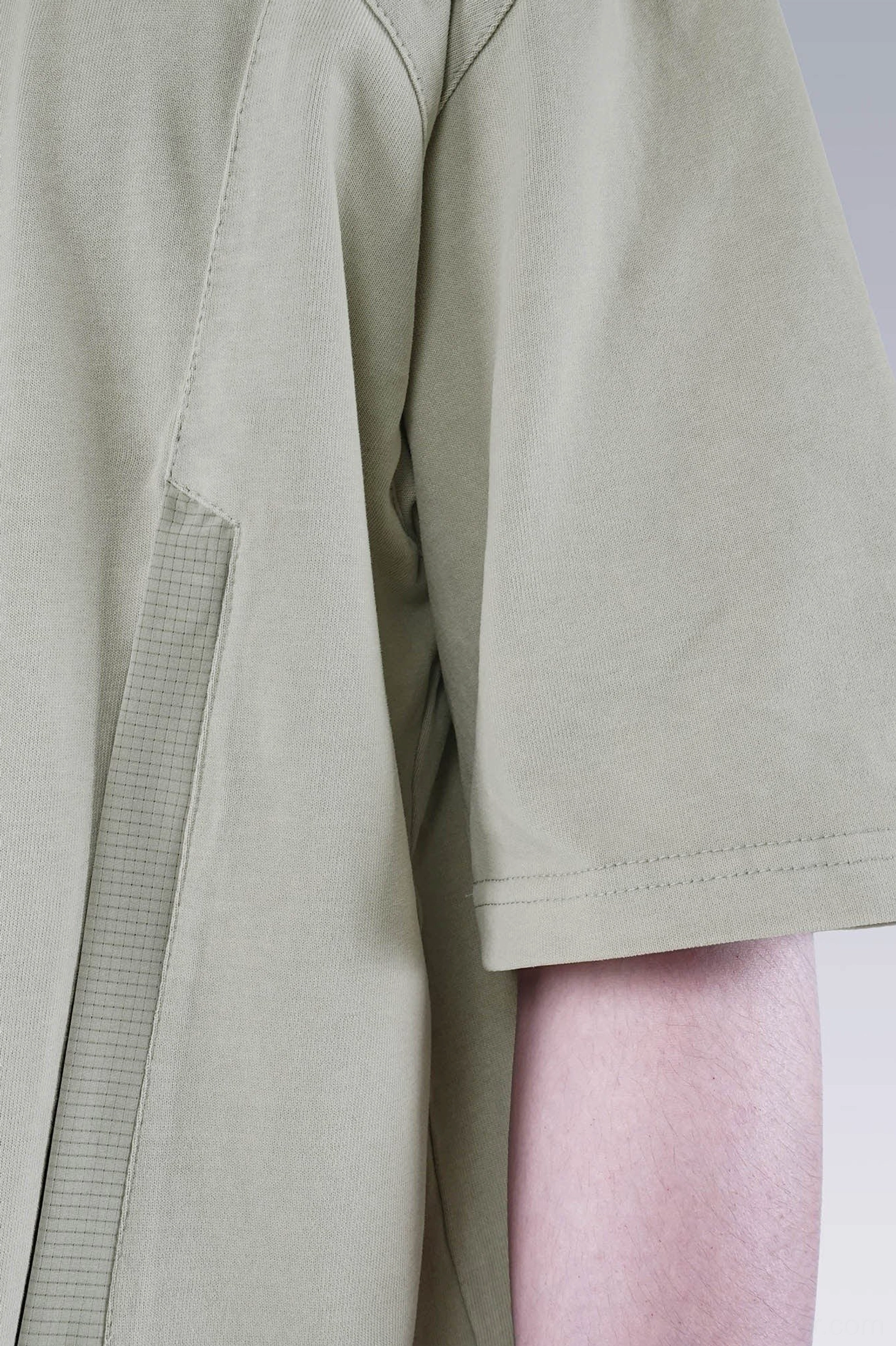 Washed technical oversized T-shirt product view highlighting relaxed Korean streetwear proportions and utility styling