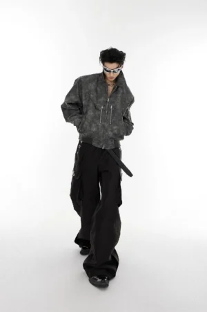 Dark gray washed vegan leather oversized cropped bomber jacket styled with black cargo pants full body front view