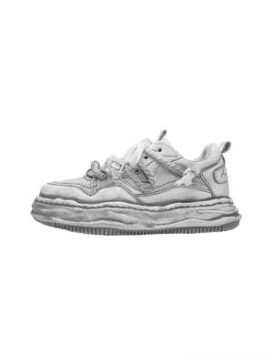 Washed wavy platform sneakers in distressed gray shown in a flat side product view with layered retro lace-up upper and thick sculpted wave sole