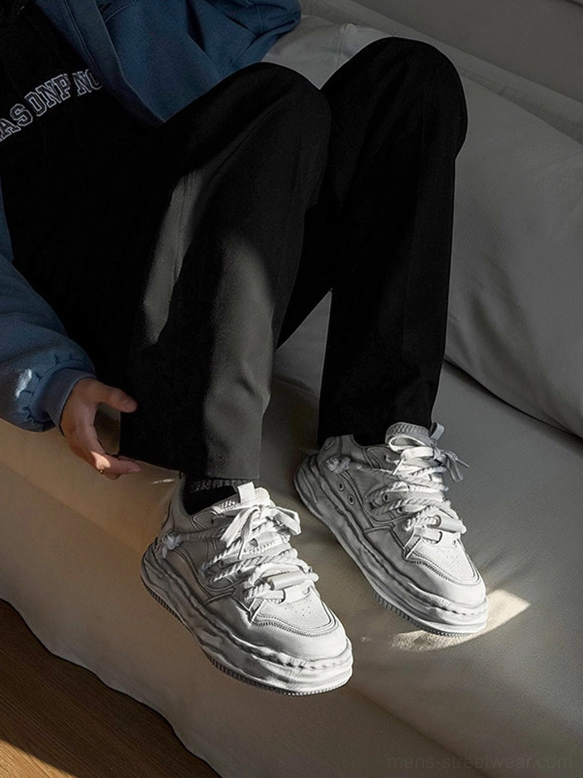 Washed wavy platform sneakers in distressed gray presented as a contemporary unisex streetwear footwear style