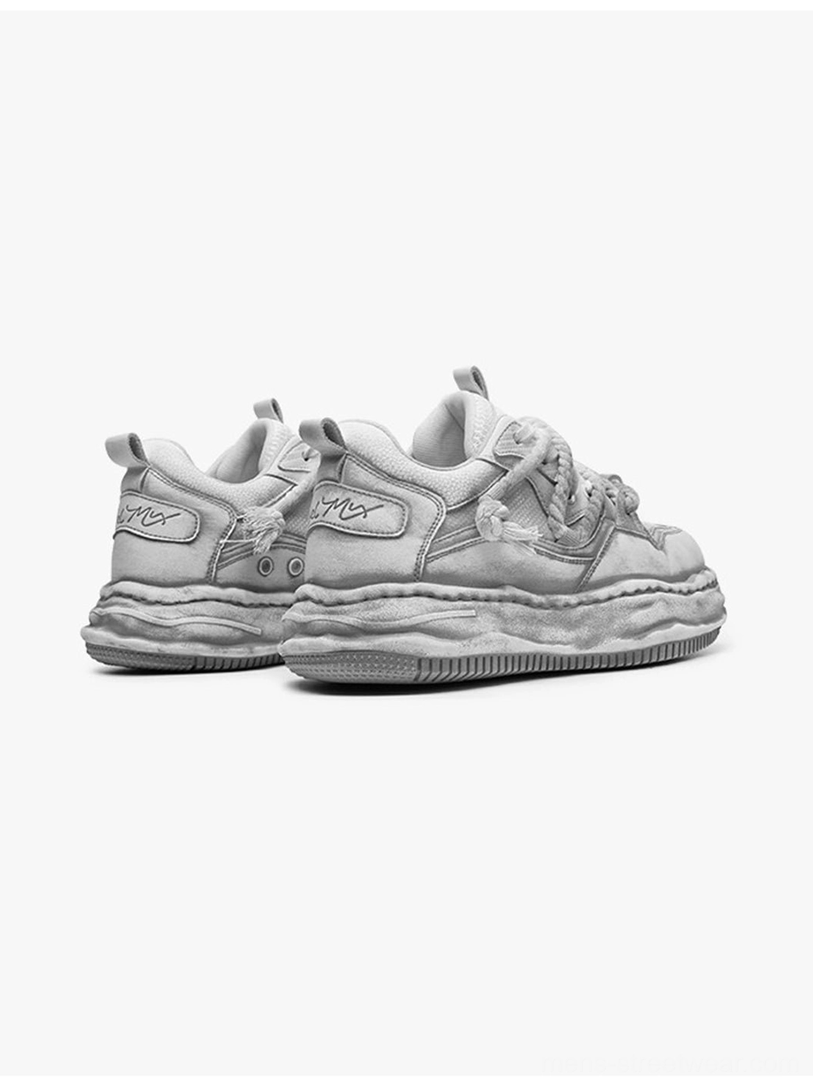 Washed wavy sole sneakers in distressed gray showing a bold retro platform silhouette for everyday urban outfits
