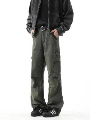 Military green washed wide leg cargo trousers front full body view with relaxed streetwear fit and utility thigh pockets