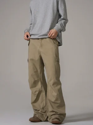 Light khaki washed wide-leg cargo pants in a relaxed Korean streetwear fit styled with a gray long-sleeve shirt and brown casual shoes