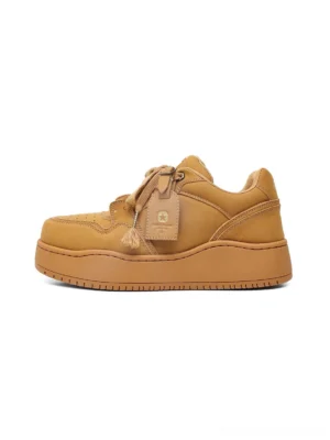 Wheat brown chunky platform sneaker shown in a clean side profile with smooth matte upper, matching thick sole, and tongue tag
