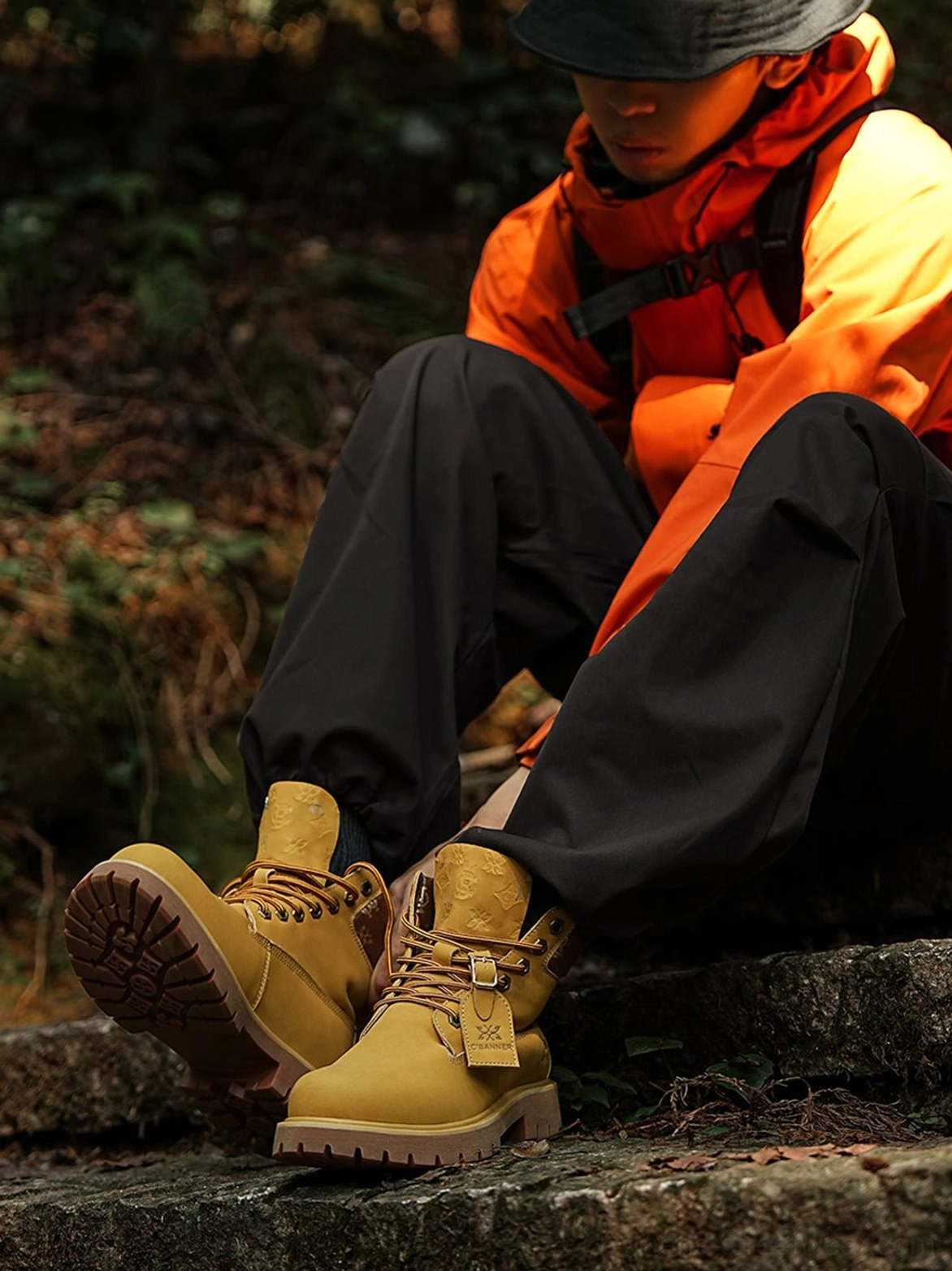 Wheat streetwear ankle work boots with bold contrast stitching, structured upper, metal eyelets, and classic utility-inspired proportions