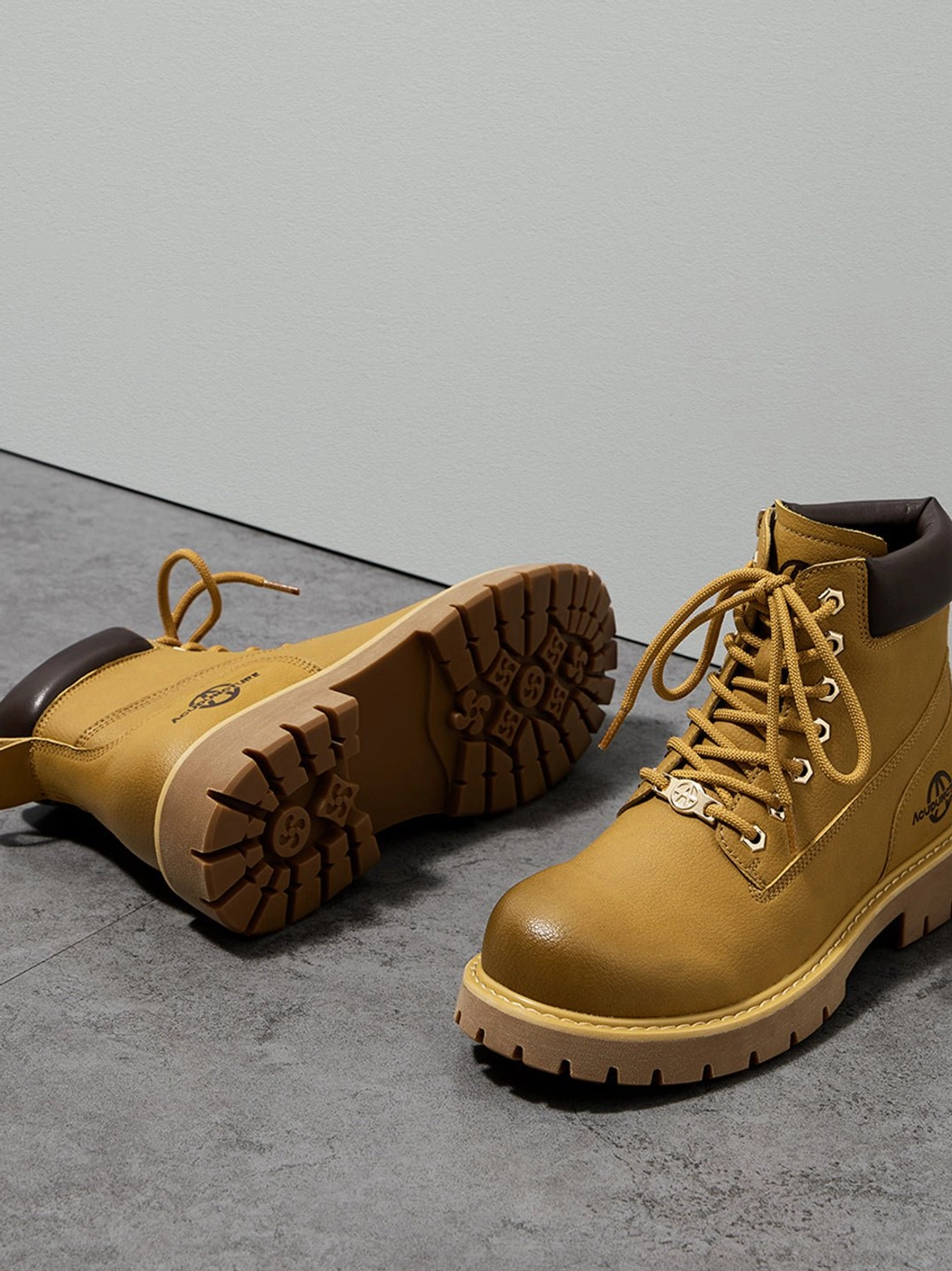 Wheat yellow and black zip-front lug sole work ankle boots for contemporary streetwear outfits