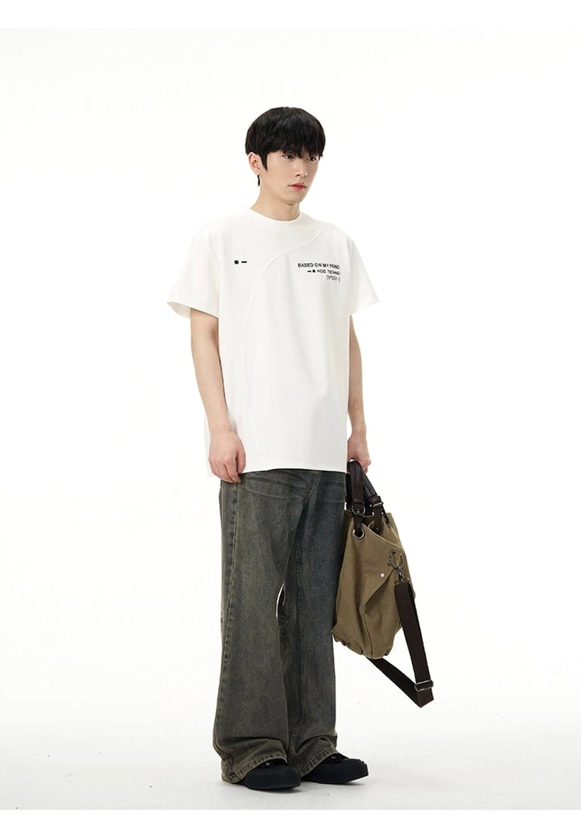White Acid Techno graphic T-shirt styled with wide-leg dark jeans and canvas crossbody bag in minimalist streetwear outfit