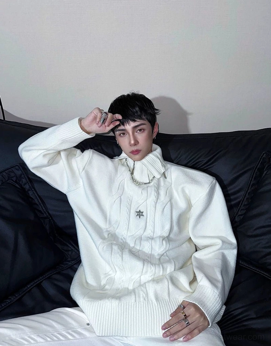 White Acubi cable knit high neck sweater styled with layered silver necklaces and relaxed streetwear proportions