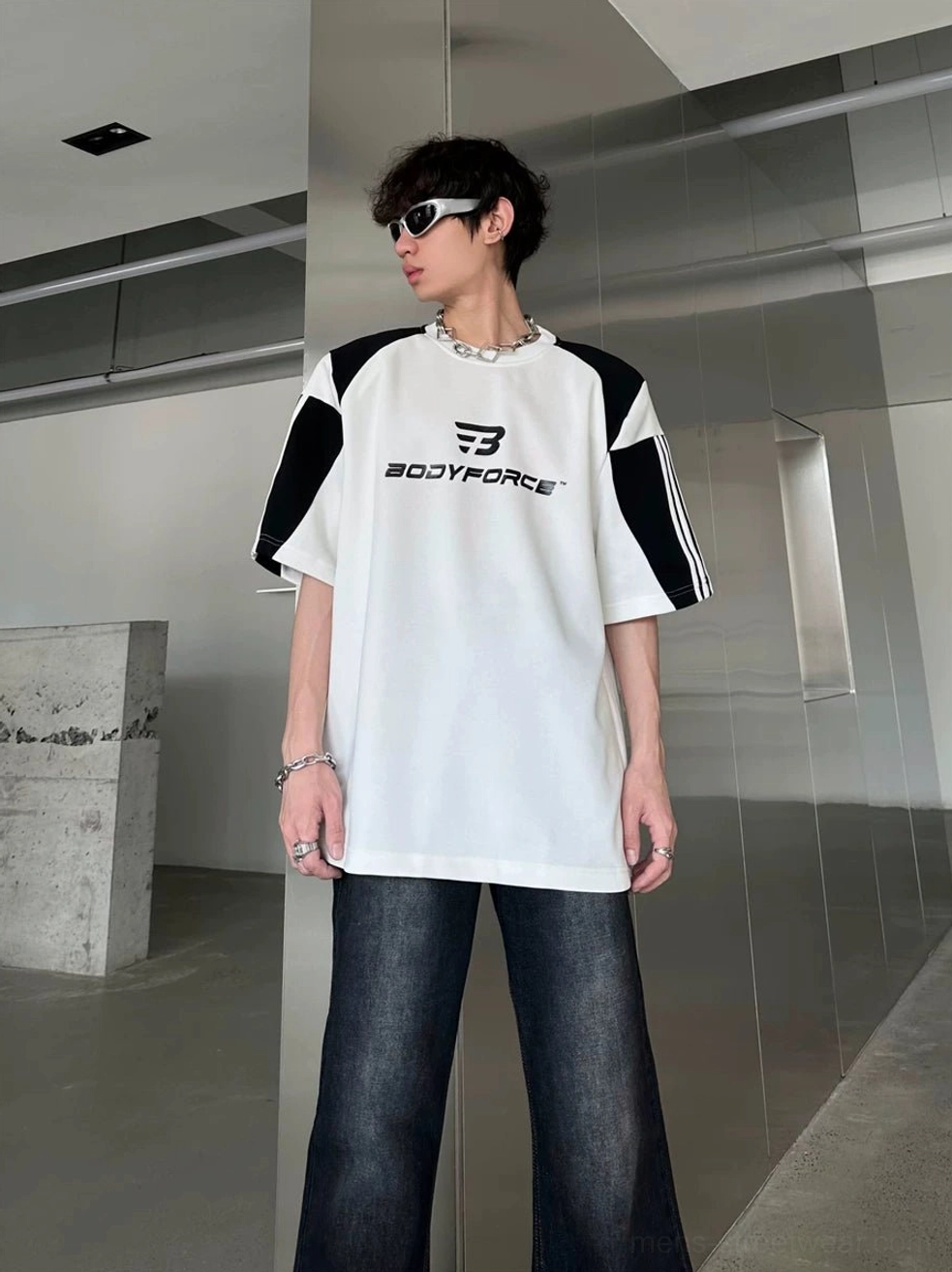 Classic white and black colorblock sport tee with sleeve stripes and loose streetwear silhouette