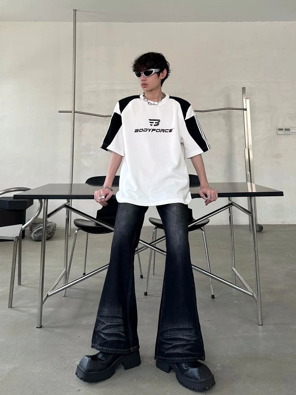 White and black relaxed sport tee with contrast panels styled with dark flared denim