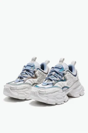 White and blue chunky platform sneakers shown in a front three quarter studio view with layered mesh panels, iridescent trims, silver toned overlays, blue laces, and heel pull tabs