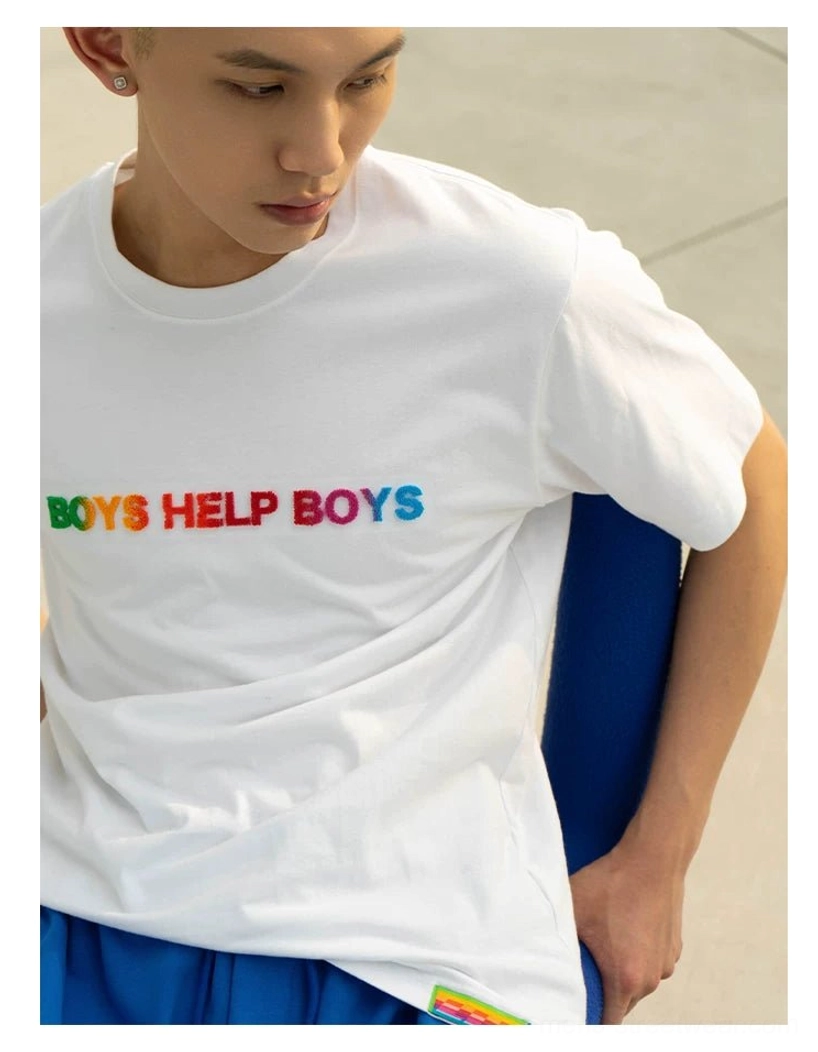 Side view of white Boys Help Boys rainbow graphic T-shirt showing smooth cotton fabric relaxed fit and colorful chest print