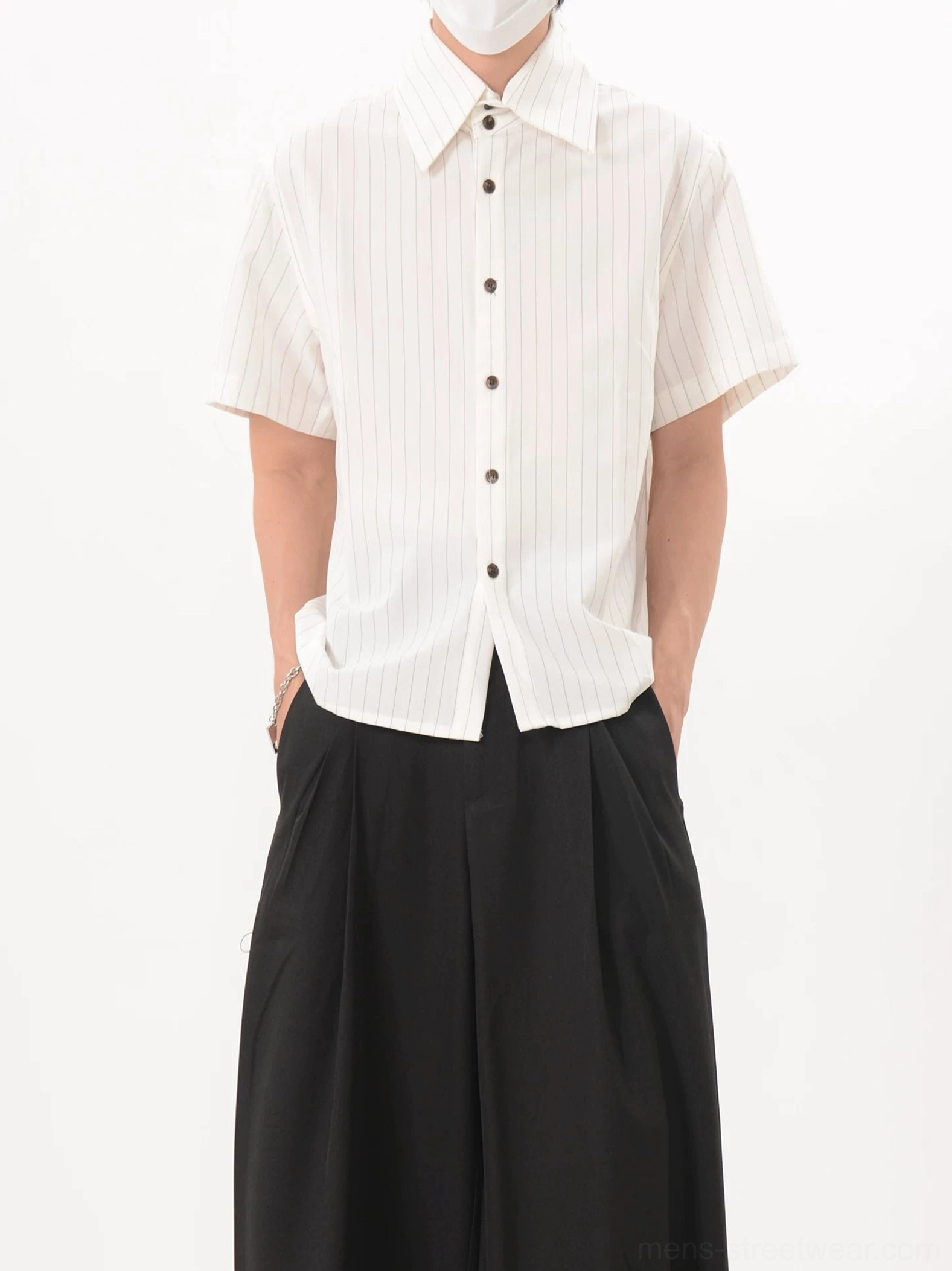 White and light brown pinstripe short sleeve shirt with pointed collar styled with black wide leg pants
