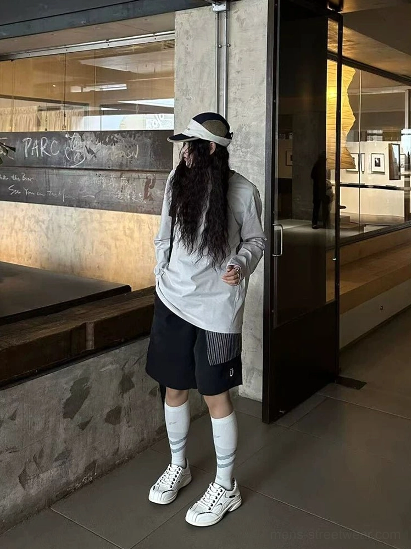 White checkered collar retro sneakers worn with a casual streetwear outfit near an urban shop entrance