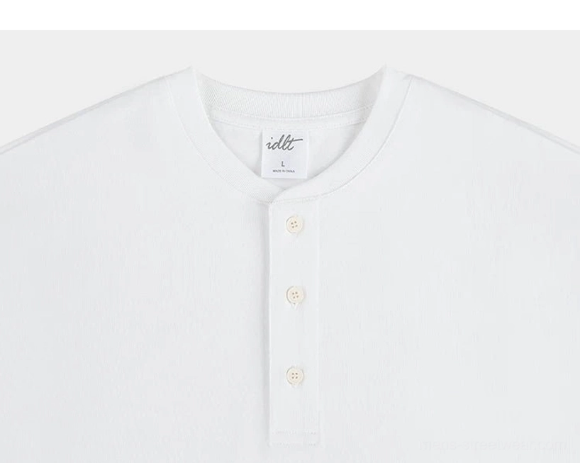 White cotton Henley T-shirt upper front detail with ribbed round neckline and clean three-button placket