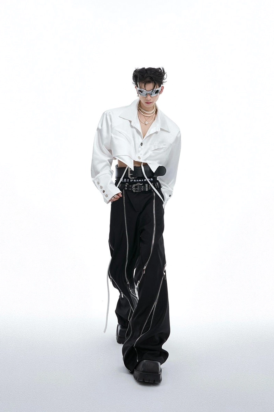 White cropped long-sleeve shirt styled with layered necklaces, dark trousers, and avant-garde Seoul streetwear accessories