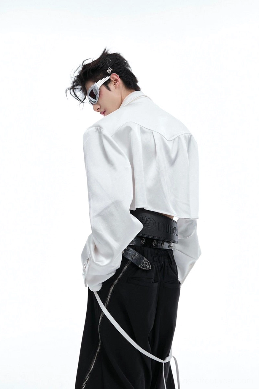 White cropped satin shirt shown from the back three-quarter view with relaxed fit, long sleeves, button cuffs, and Korean fashion styling