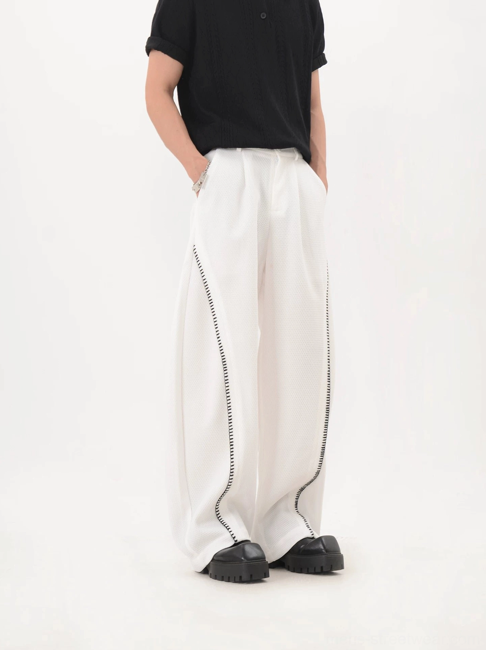 White curve trim mesh texture wide leg streetwear trousers with black contrast side detailing front view