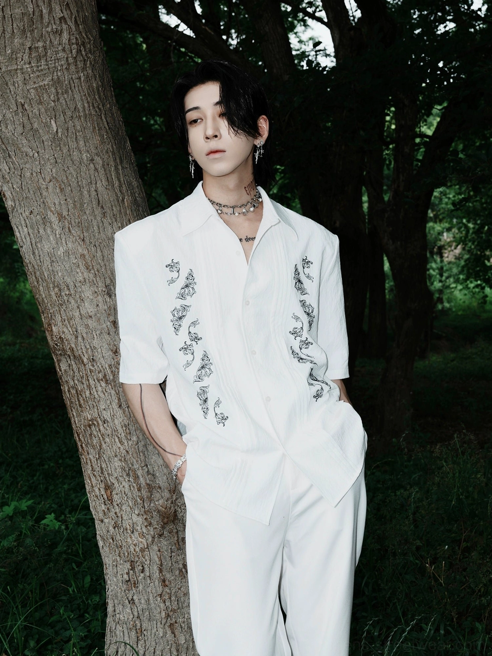 White dragon embroidered Cuban shirt with relaxed fit styled with white wide-leg pants in an outdoor Korean streetwear look