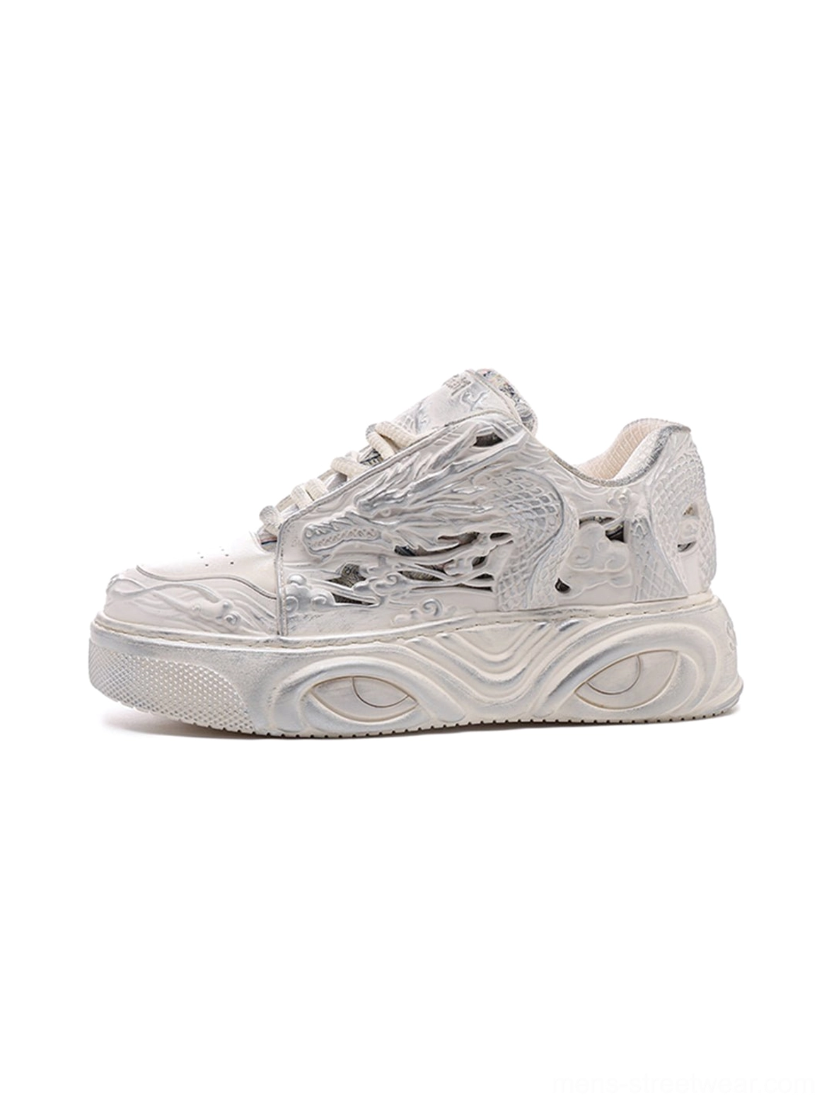 White dragon relief platform sneakers shown from a left three-quarter angle with embossed upper panels and a thick wavy sculpted sole