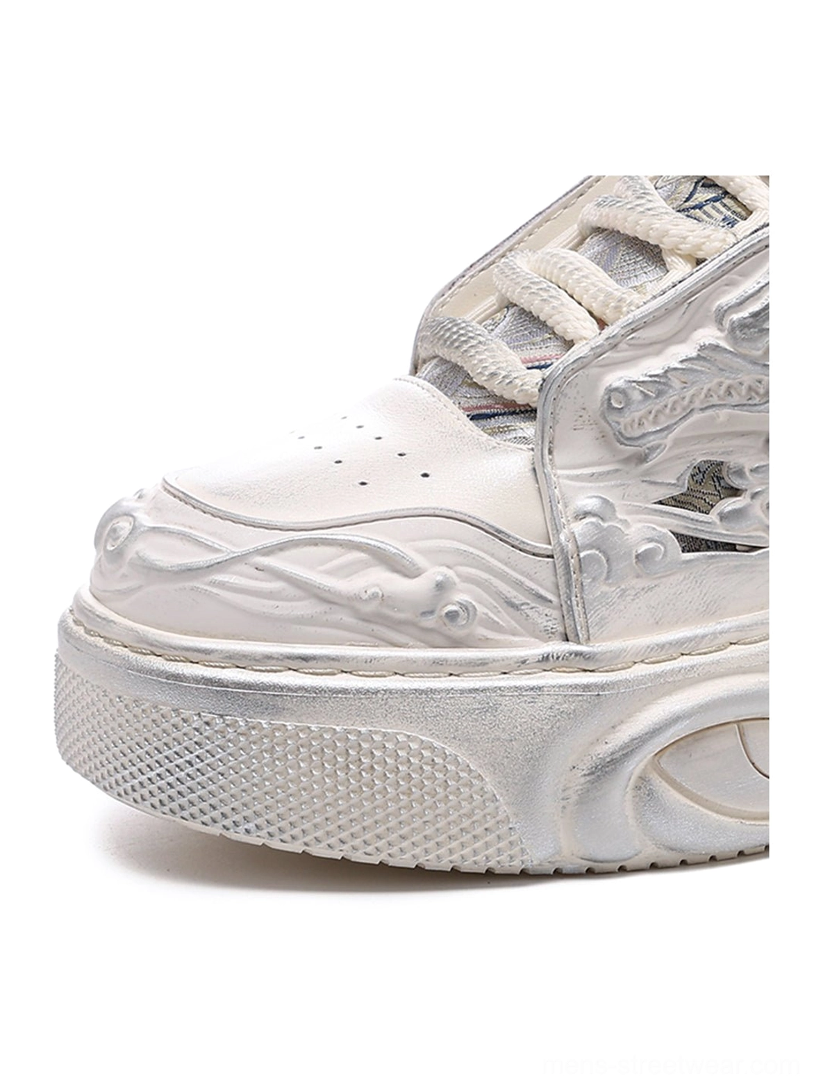 White dragon relief platform sneakers showcasing the clean monochrome finish, chunky platform construction, and avant-garde silhouette