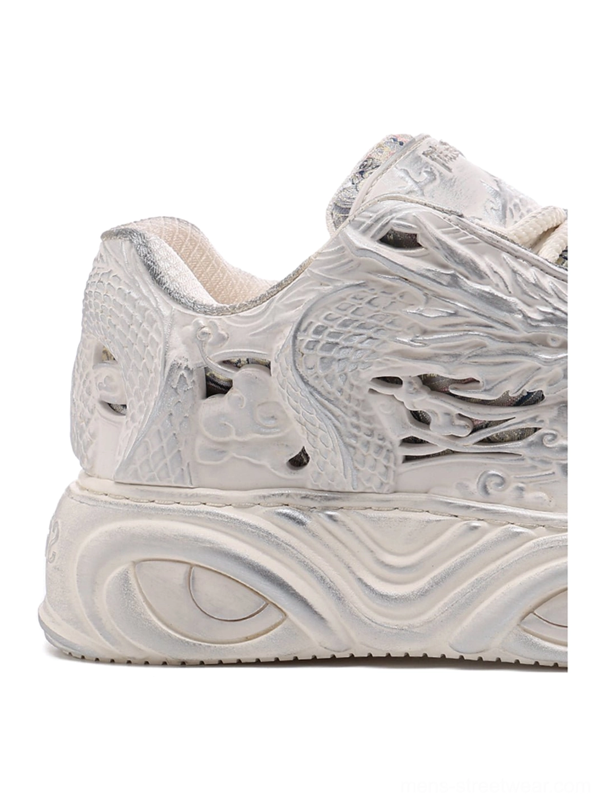 White dragon relief platform sneakers product image highlighting the sculpted silhouette, embossed texture, and contemporary streetwear design