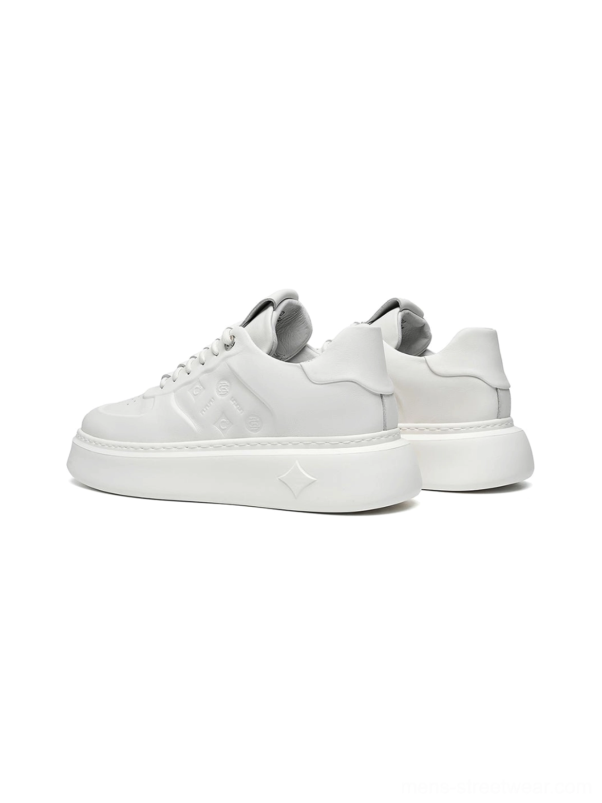 White embossed monogram chunky platform streetwear sneakers close-up showing low-top lace-up construction