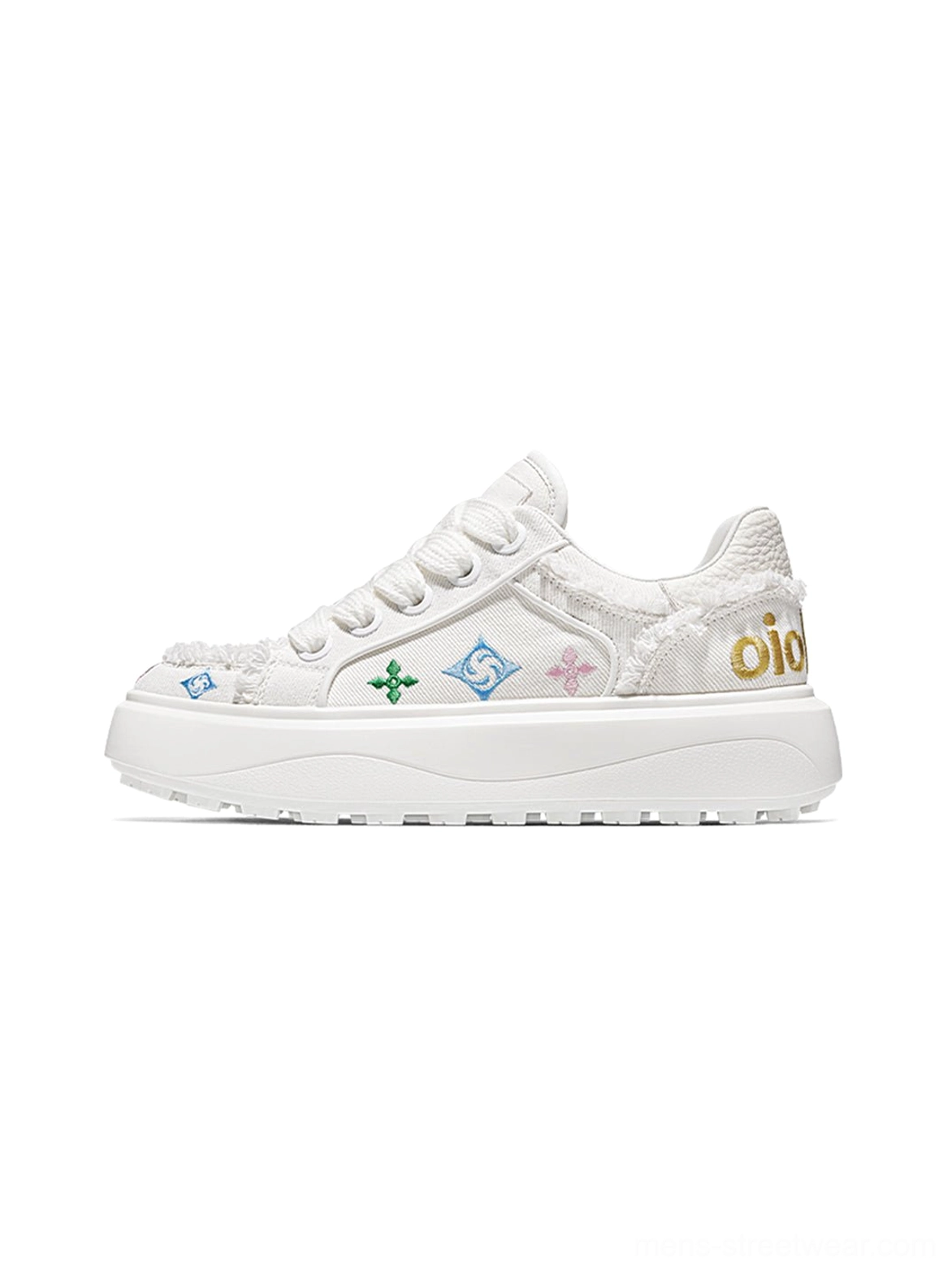 All-white low-top platform skate sneakers with colorful embroidered monogram accents frayed canvas-style trims gold heel lettering and a chunky white outsole