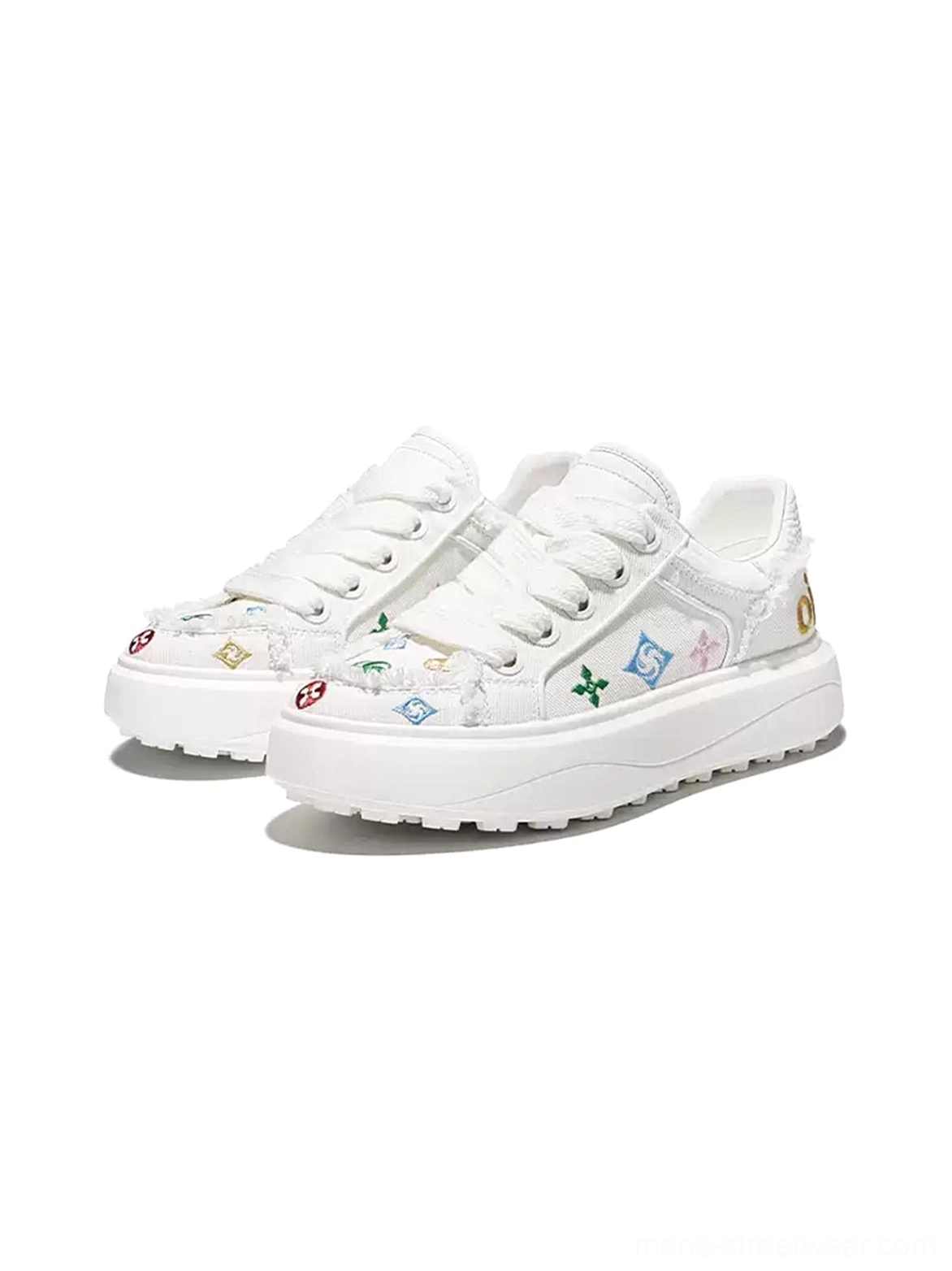 Front view of a pair of white low-top platform skate sneakers with colorful embroidered accents on the toe and sides frayed trims gold heel lettering and thick white soles
