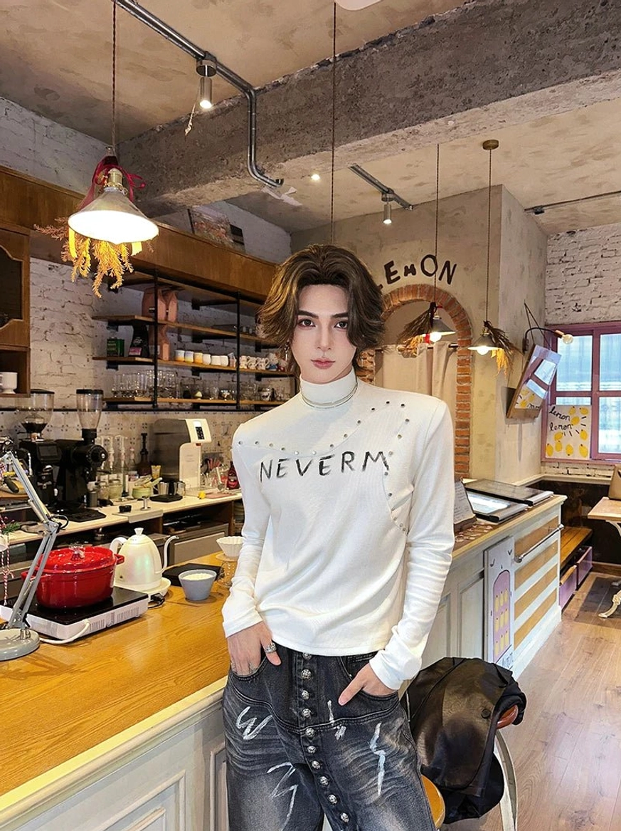 White fleece gothic turtleneck sweater with studded collar details, graphic chest print, and fitted alternative streetwear silhouette