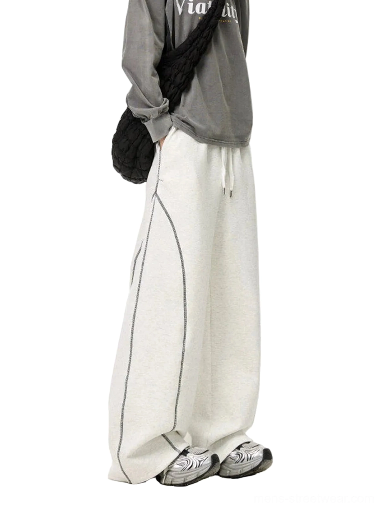 White Flower Gray oversized balloon sweatpants rear side view showing curved contrast seams and wide draped silhouette