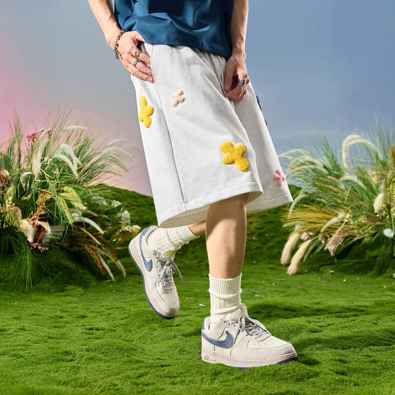 White flower gray relaxed drawstring sweat shorts with scattered 3D floral decorations in outdoor streetwear styling